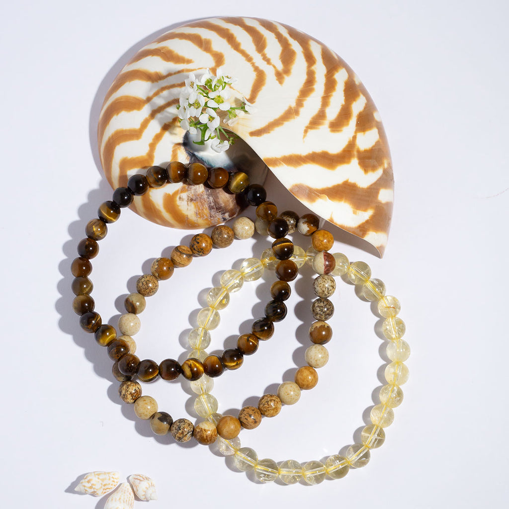 A beautiful trio of stretch bracelets in radiant shades of yellow and brown.