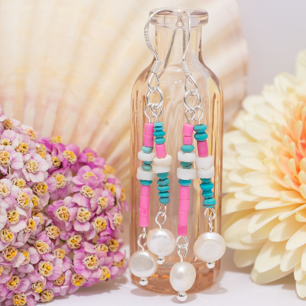 A dance under the Palm trees in a coconut bra and the Island pearl Swing earrings, so dream on wearing our newest earring style.