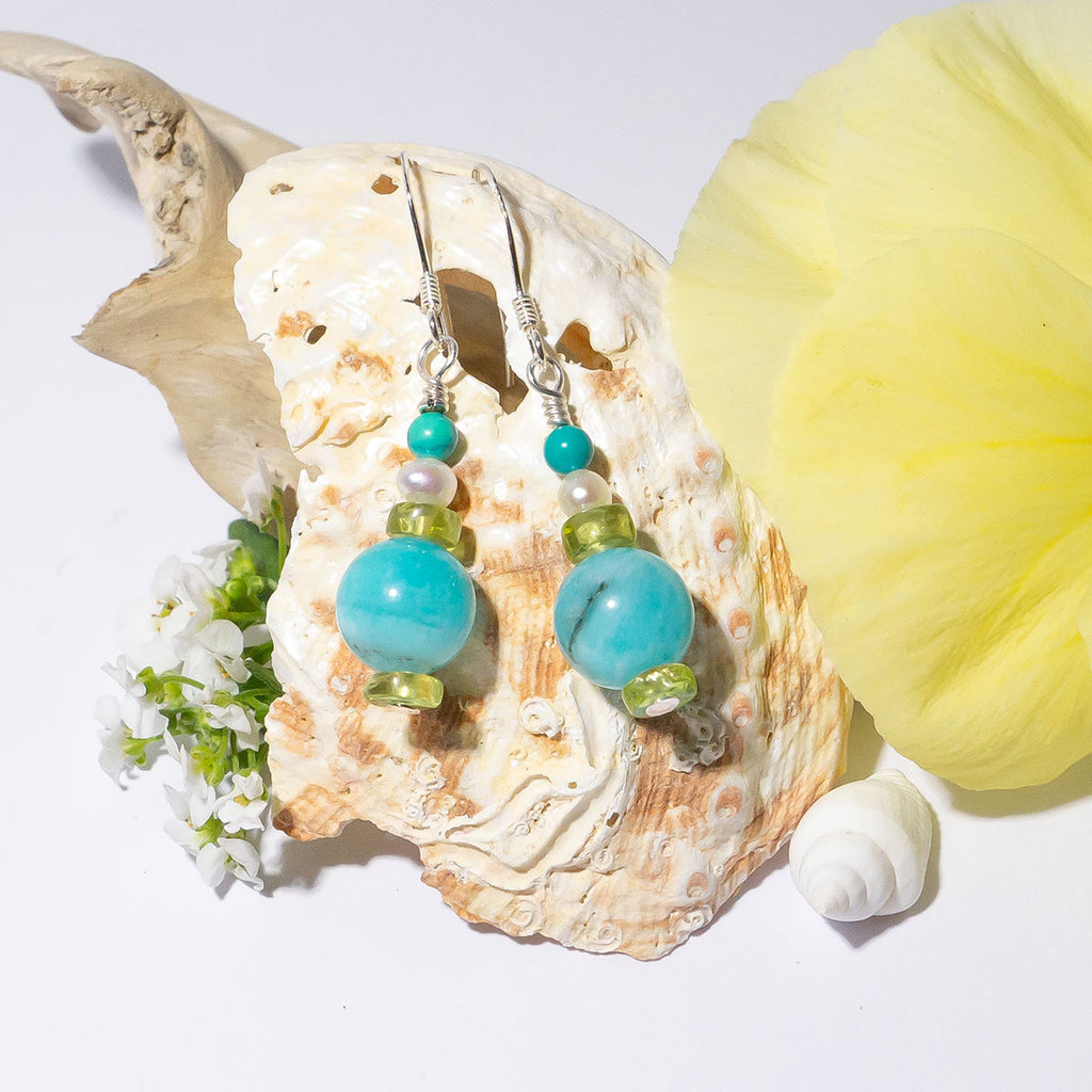 Featuring shades of a tropical lagoon these delicate gemstone droplet earrings are the perfect accessory for Spring & Summer.