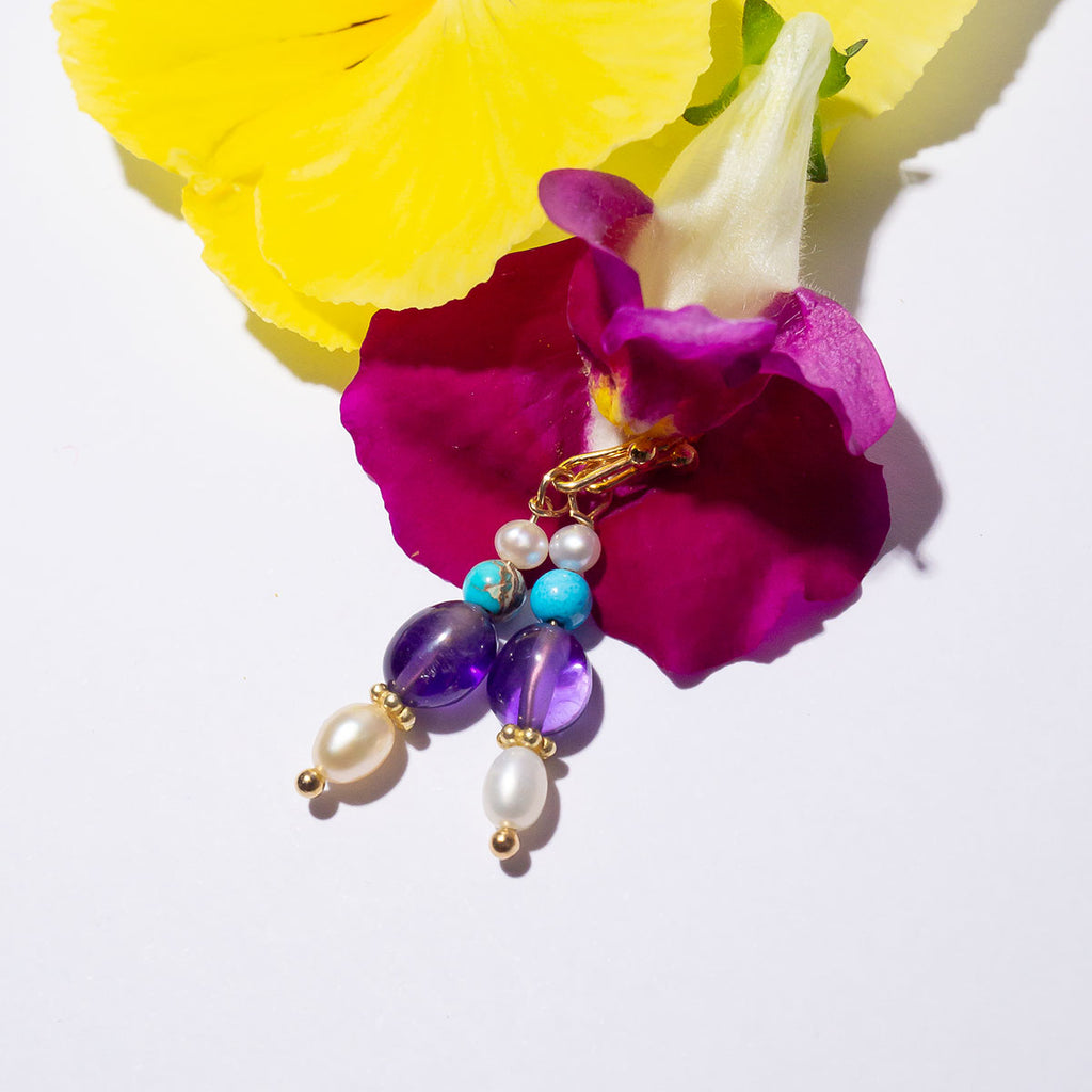 Our Inez gemstone earrings bring you a pretty tumble of colourful shimmering gemstones.