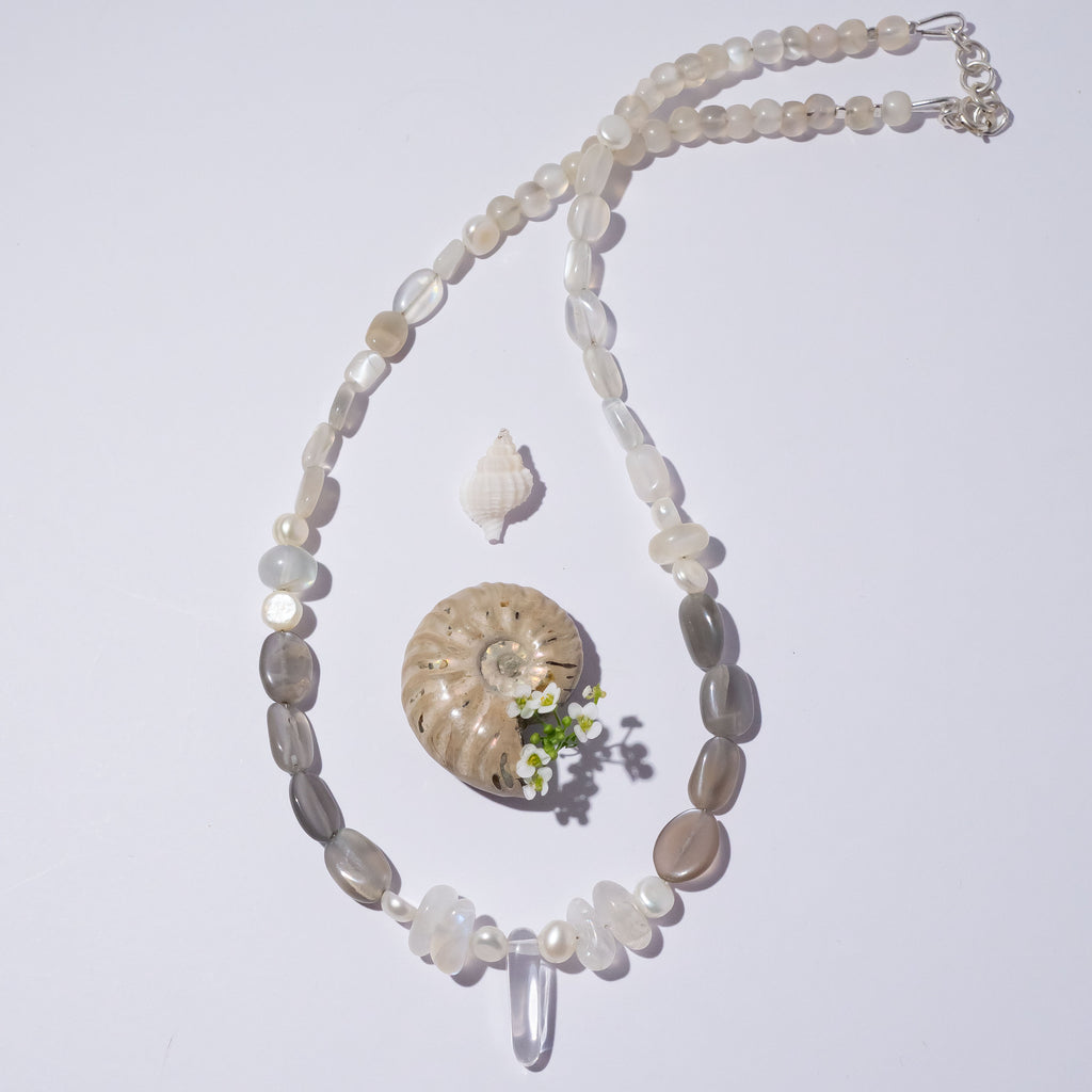 Like the soft shimmering swirls of an early misty morning our ethereal Necklace Cay Crystal Moon feels just a little bit magical.