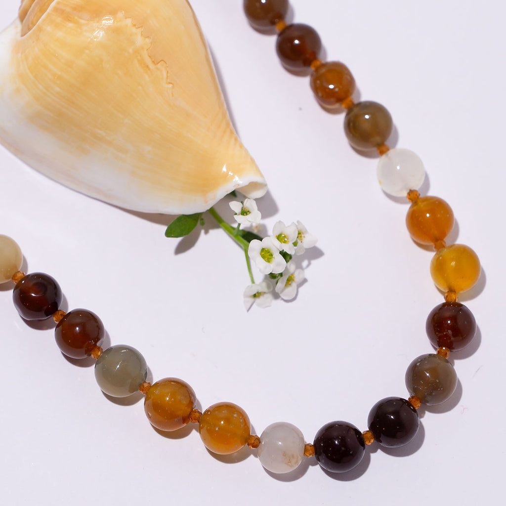 A beautiful mix of natural tones this beautiful chic necklace is perfect for warming up your next outfit.