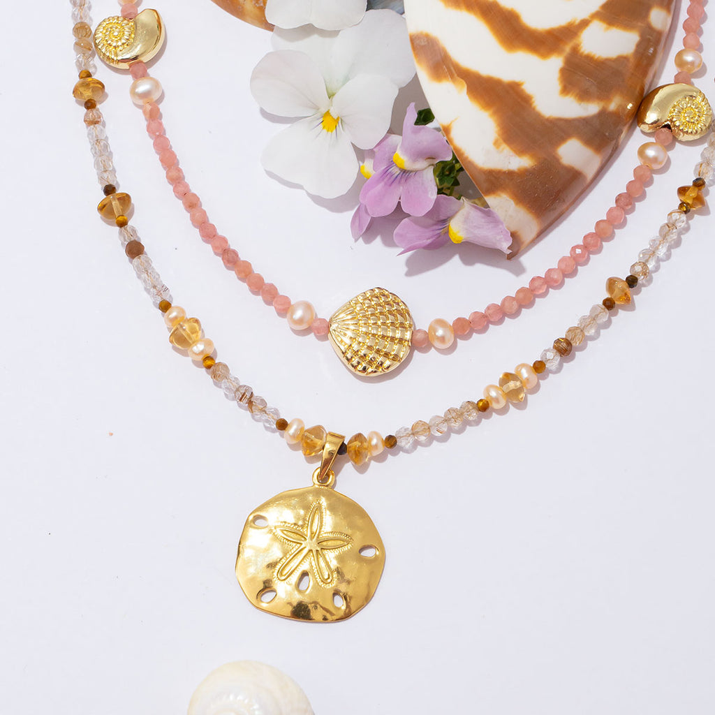 A perfect golden sand dollar set amongst sparkling golden rutile. This is a gorgeous & glowing Summer necklace.