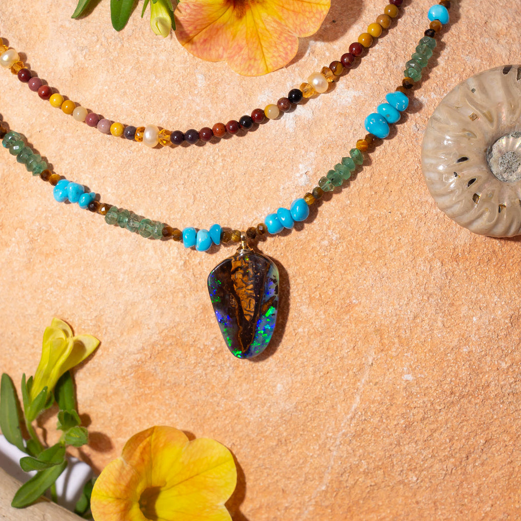 Inspired by daydreams of the extraordinary Marquesas Islands this exceptional piece features Australian Boulder Opal, Zambian Emeralds and Sleeping Beauty Turquoise from Arizona.