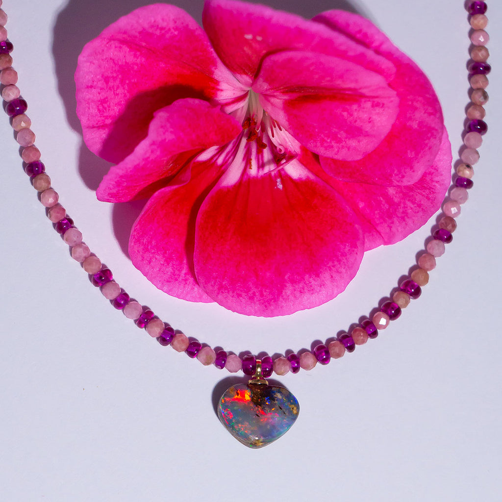 This enchanting necklace features a magical Australian Opal heart pendant and perfect raspberry pink rubies.