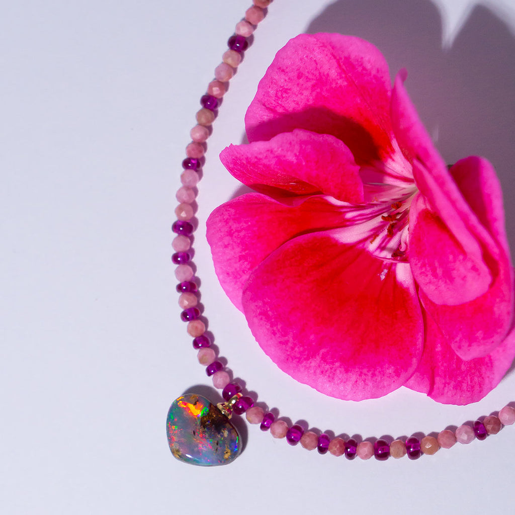 This enchanting necklace features a magical Australian Opal heart pendant and perfect raspberry pink rubies.