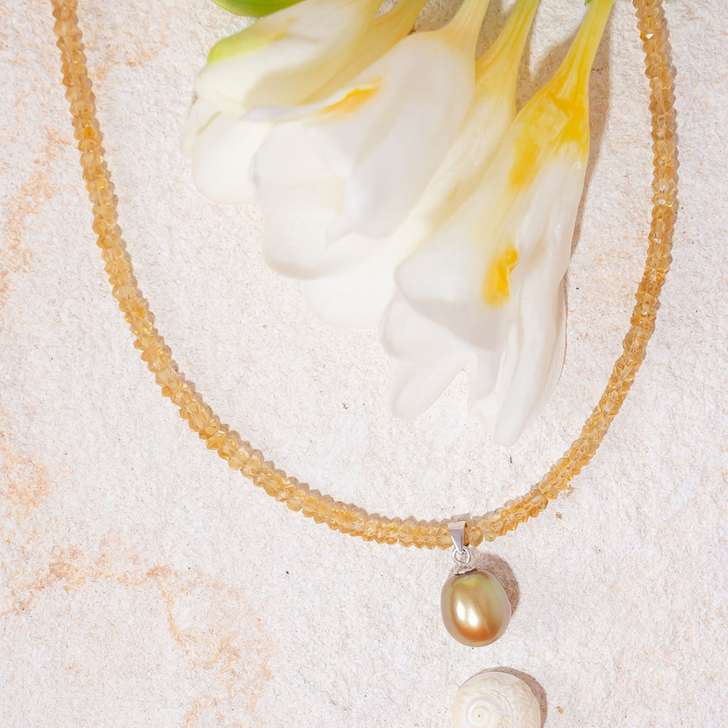 Like the sunshine after the rain this radiant necklace shimmers, shines & sparkles.